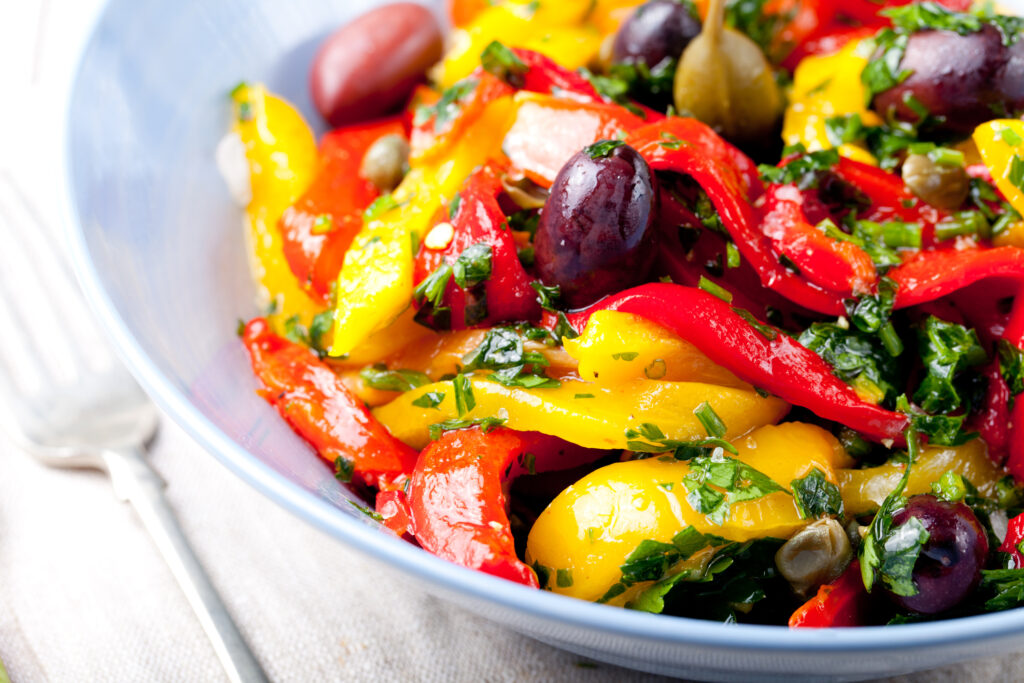 Roasted yellow and red bell pepper salad. Grilled vegetables.